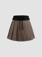 Mid Rise Houndstooth Knotted Pleated Mini Skirt
